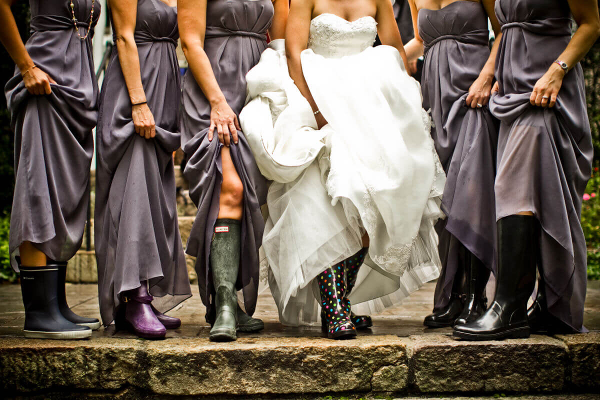 Bride Posing With Her Friends Wearing Boots