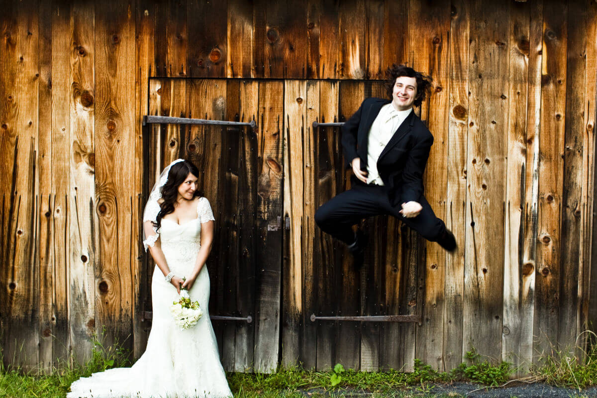 Energetic Wedding Couple Having Fun During Their Countryside Wedding In Pennsylvania